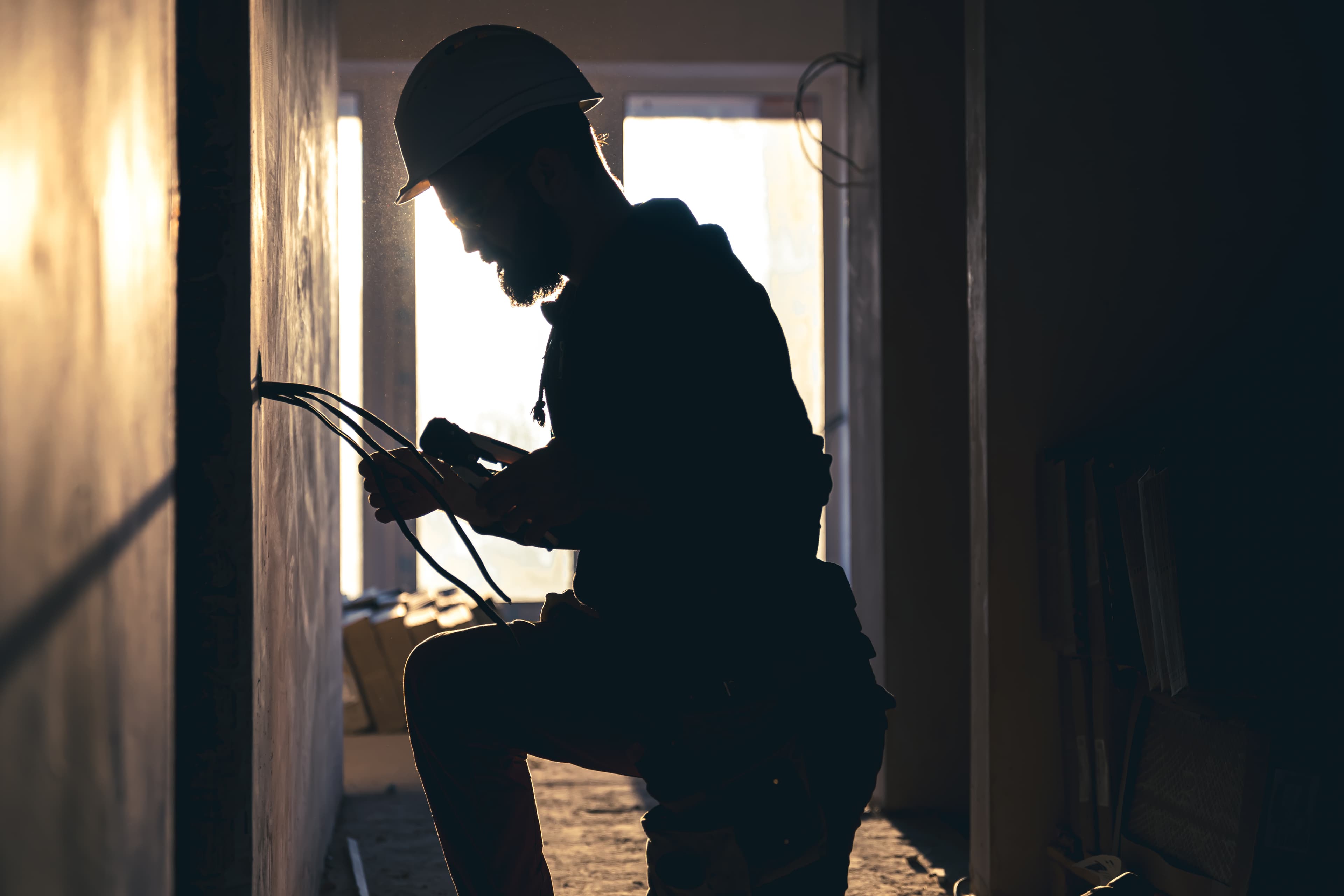 worker-is-cutting-wires-with-lineman-s-pliers